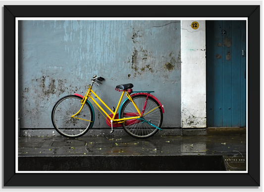 Vibrant Pause: The Yellow Bicycle's Tale